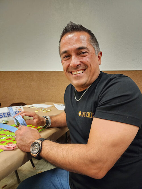 Vicken Aghchikian smiling playing Bingo.